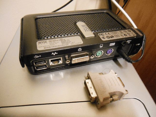 Wyse CX0
Back side, showing: 2 USB ports, Ethernet, DVI, PS/2 for mouse and keyboard, AC adapter, and Kensington lock. Date of manufacture September 2012.
